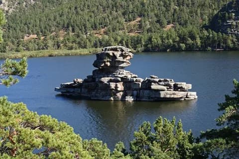 Turquoise lake and granite cliffs in Burabay National Park
